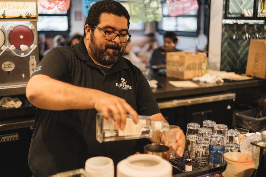Nacho Padres bartender pouring a cocktail