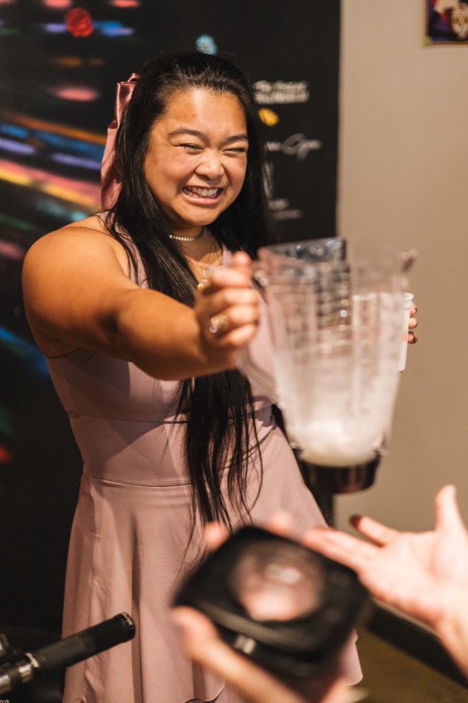 Guest laughing with a blender of frozen margaritas